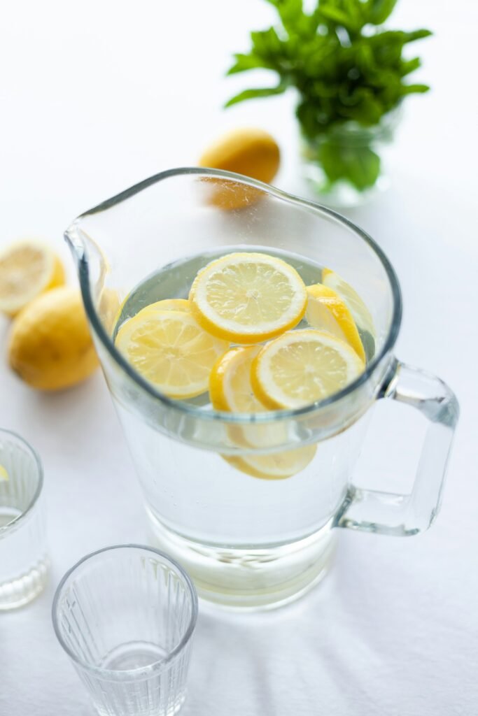 Jug filled with water and few lemon pieces